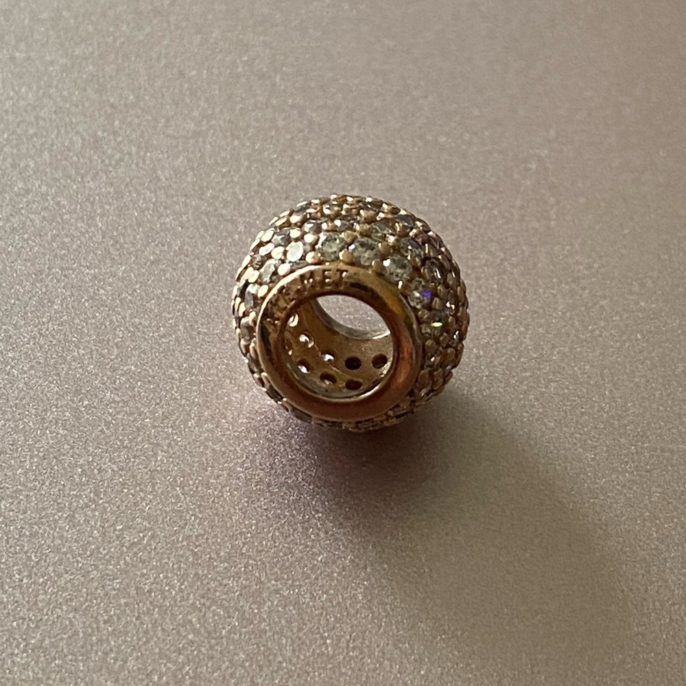 Retired Pandora Rose Gold plated Pave Lights charm.